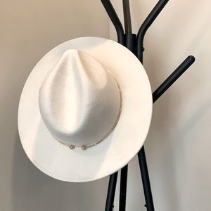 White hat, with gold detail.
